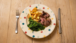 The wilted leaves, "horta" style with wood pigeon and local chips.