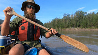 Making a canoe paddle while paddling the Yukon