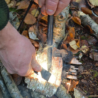 Forest Fundamentals Beast Ferrocerium rod - this is the 8" version. Shown with sparks onto Birch bark