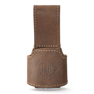 A Hults Bruk Brown leather axe holster or loop, worn on the belt to carry an axe. Shown here with a stamped HB logo, and complimenting stiching. 