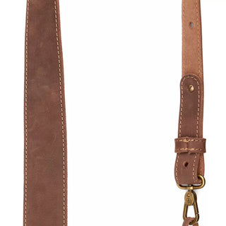 Hults Bruk Leather Axe Sling - a brown leather sling with brass fittings. 