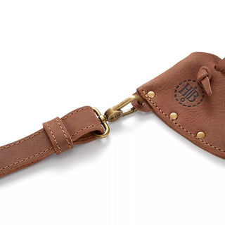 Hults Bruk Leather Axe Sling - a brown leather sling with brass fittings and a stamped HB logo
