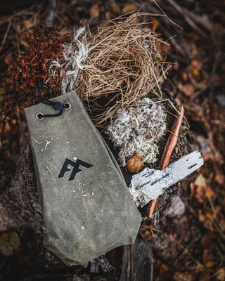 Forest Fundamentals Tinder Pouch, a hand crafted waxed canvas pouch for carrying tinder or anything else! Shown here with some tinders to give a sense of scale. 
