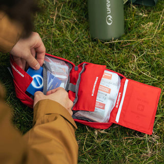 LifeSystems Adventurer first aid kit, a red pouch containing first aid supplies.