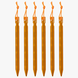 Highlander Arrow aluminium tent pegs. 7" (18cm) pegs to secure your tarp or tent against bad weather, when pitched on hard or soft ground. Bright orange colour with high visibility cord to reduce loss.