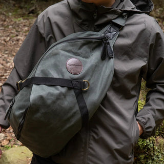 The DD Crosswind Sling bag, shown here diagonally across the front of a person's body.
