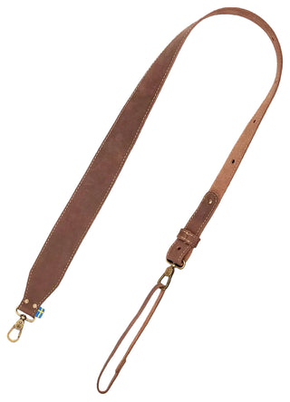 Brown leather axe sling with brass clasps and a Swedish flag label.