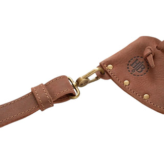 Brown leather axe sling with brass clasps and the Hults Bruk logo