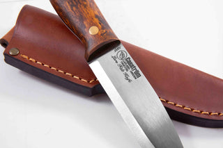 Casstrom Lars Falt fixed blade knife. Brown curly birch handle, spear point blade and a leather sheath.