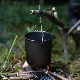 Stainless steel wire bail handles for cups or pots of a small diameter, with two clips to attach. Shown over the fire with a cup hanging.