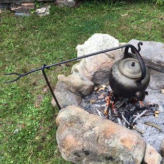 A forged squirrel cooker, to hang pots or kettles above a fire with the hook, or use the toasting fork on the other side to cook our food directly over the fire!