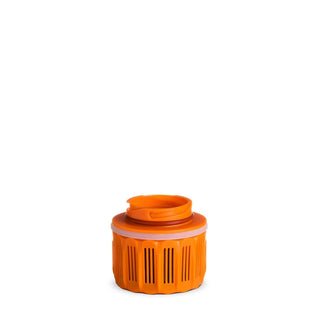An orange Grayl GeoPress replacement cartridge for water purification.